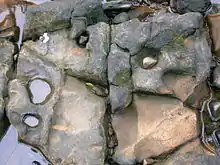 Rock-cut basins with the eroding pebble in situ.