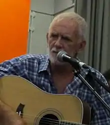 Davis live on stage with The Quarrymen in 2011.