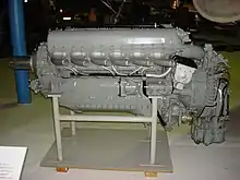 A left side view of a gloss grey -painted aircraft piston engine on static display