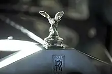 The Spirit of Ecstasy hood ornament (kneeling version) on the car