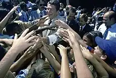 Photograph of Reagan shaking hands in a crowd