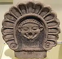 Roof ornament with Medusa's head. Etruscan, from Italy, 6th century BC. National Museum of Scotland, Edinburgh