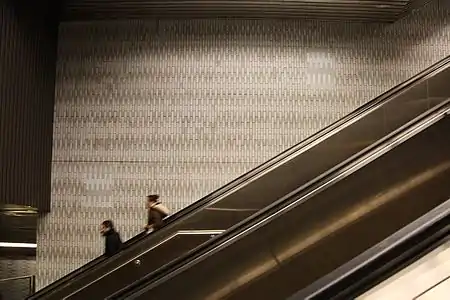 This long escalator between the mezzanine and the headhouse is necessary as the station is deep enough to pass under the East River.