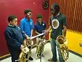 Music instructor, Lloyd Downs with brass section students 12/8/2015