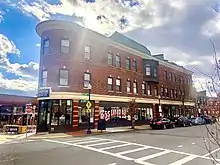 A portion of Roslindale Square on Belgrade Ave., directly across the street from the Roslindale Village Commuter Rail stop.