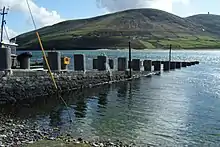 Long ferry pier, sloping into the water