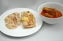 Singaporean roti prata served with curry