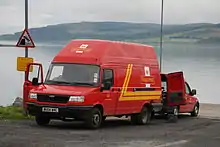 Modern Royal Mail vans.
