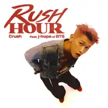 Overhead shot of Crush in a denim jacket standing and looking up into the camera, surrounded by a white background. "Rush Hour" is written in red uppercase text to the top left side of the photo, with "Crush Feat. j-hope of BTS" underneath it in smaller print.