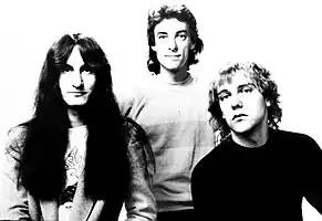 Rush promotional image with Lee, Peart, and Lifeson, left to right