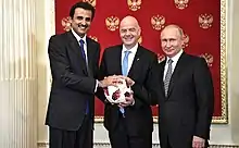 Image 15Russia handing over the symbolic relay baton for the hosting rights of the 2022 FIFA World Cup to Qatar in June 2018. (from Political corruption)