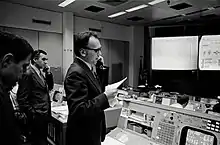 Photograph of Luboš Kohoutek at the mission control center at the Johnson Space Center