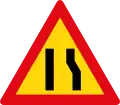 Road narrows on right side