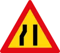 Road narrows on left side