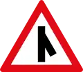 Skewed side road junction ahead to right