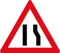 Road narrows on right side