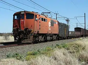 No. E1557 in Spoornet orange livery at Slypklip near Warrenton, Northern Cape, 22 September 2006