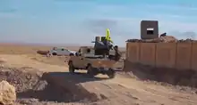 A SDF technical in a village captured from ISIL on 15 November 2016