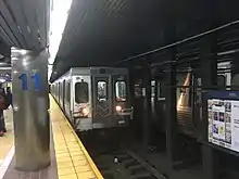 A train bound for 69th Street Transportation Center arrives at the station