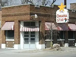 Brick Building with Omaha Star sign.