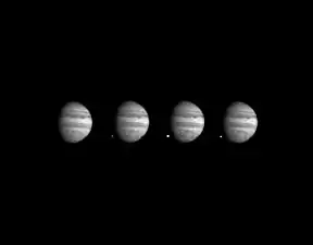 Comet Shoemaker–Levy 9 colliding with Jupiter: The sequence shows fragment W turning into a fireball on the planet's dark side