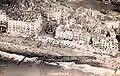 Aerial view of SM U-118 in front of the Queen's hotel.