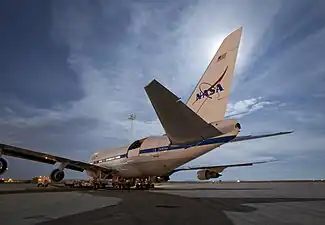 SOFIA sat on the tarmac during night-time telescope operations.