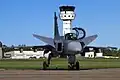 A Saab JAS 39 Gripen and the control tower