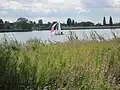 View of sailing boat on Brent Reservoir from Welsh Harp Open Space