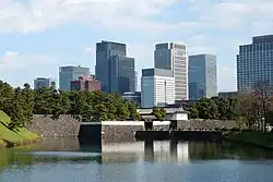 Sakurada-mon of the Imperial Palace with Marunouchi office buildings in the back