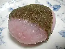 Dōmyōji consists of a sweet pink mochi and red bean paste, covered with a cherry blossom leaf.