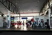 Passengers line up at the fare gates of Platform 1 to exit the Salak Selatan LRT station.