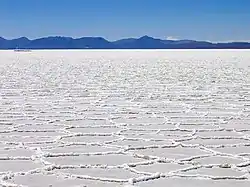 Hexagonal formations on the surface of the Salar de Uyuni as a result of salt crystallization from evaporating water