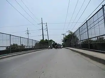 Steel pole 234 (of anchor or flag design) near Tulaoc Overpass in San Simon, Pampanga. Note that it uses NAPOCOR-era steel pole 228.