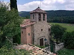 Landscape of Lluçanès with the Sant Agustí de Lluçanès church in the foreground.