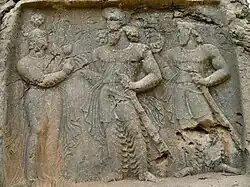 Tang-e (or Sarab-e) Qandil relief depicting a divine investiture scene of Bahram II receiving a flower by the goddess Anahita