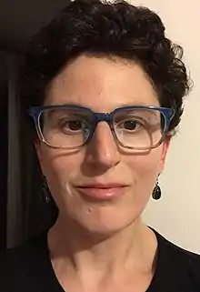 close up head shot of author sarah weinman in glasses