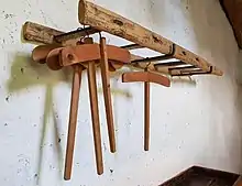 A ladder repurposed as a coat rack in Sardinia