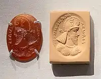 Sasanian seal of an official wearing the kulāf, with Pahlavi inscription "Roz-bud, chief wine-purchaser" (disputed), excavated in Northern Syria. 5th century CE, British Museum, 135071