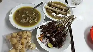 Gule kambing, goat meat Javanese gulai, It is served with goat satay