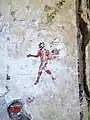 A mural of a striding Satyr carrying the thyrsus painted in the 1st century AD; Archaeological park of Baiae