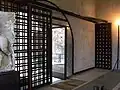 Ornate metal lattice door designed by Carlo Scarpa