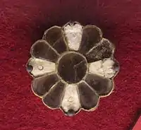 Alemannian disc fibula of the 6th century with almandine and bone inlays