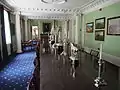 Dining room with silver candelabras and figures
