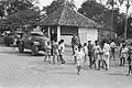 Braat Overvalwagen (background, partially obscured) and Marmon-Herrington Mk III (foreground) of KNIL 1st Infantry Battalion in Tangerang, 28 May 1946.