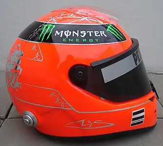 Schuberth helmet for the 2011 season (Mercedes GP); Schumacher kept using a red-coloured helmet at Silver Arrows. Chinese dragon illustration and a Chinese character "力" ("power") are inscribed on the back of the helmet.