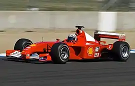 A Ferrari F2001 in non-tobacco livery being driven in Laguna Seca