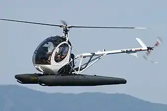 Schweizer 300 with inflatable floats