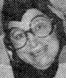 An older woman with large round glasses, wearing a costume with a peaked hood; in black-and-white newspaper photo from 1978.