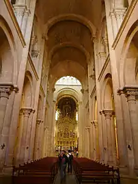 Barrel vaulted nave with a high placed arched gallery.